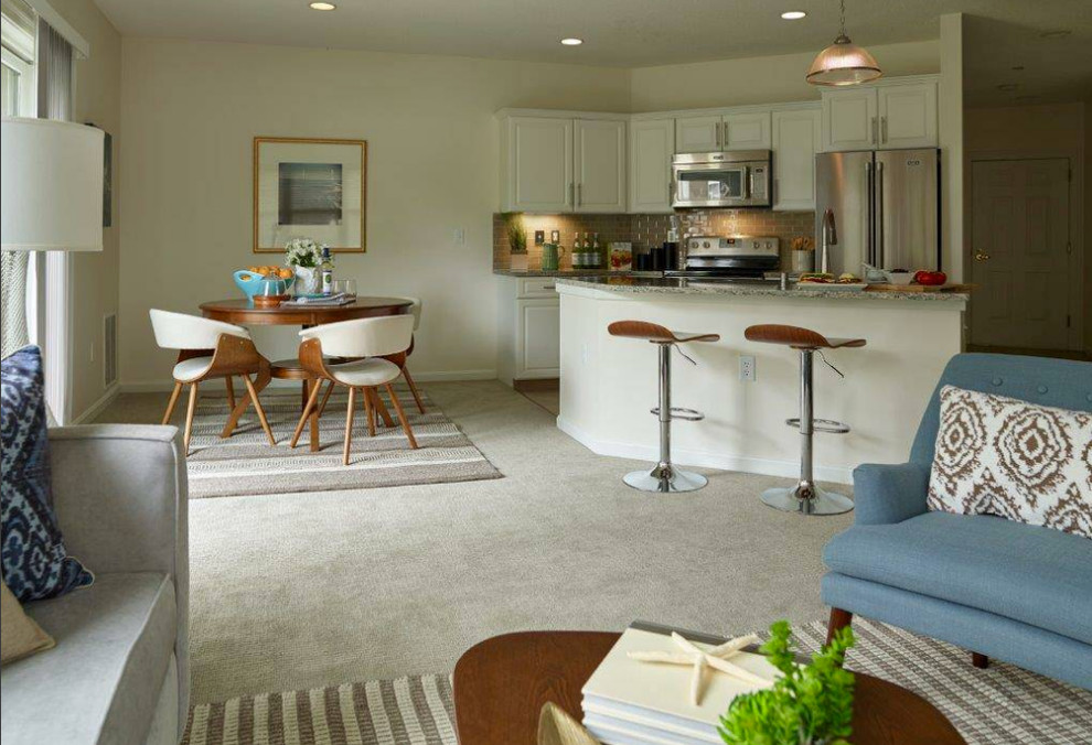Design ideas for a small contemporary open plan dining in Portland Maine with white walls, carpet and no fireplace.