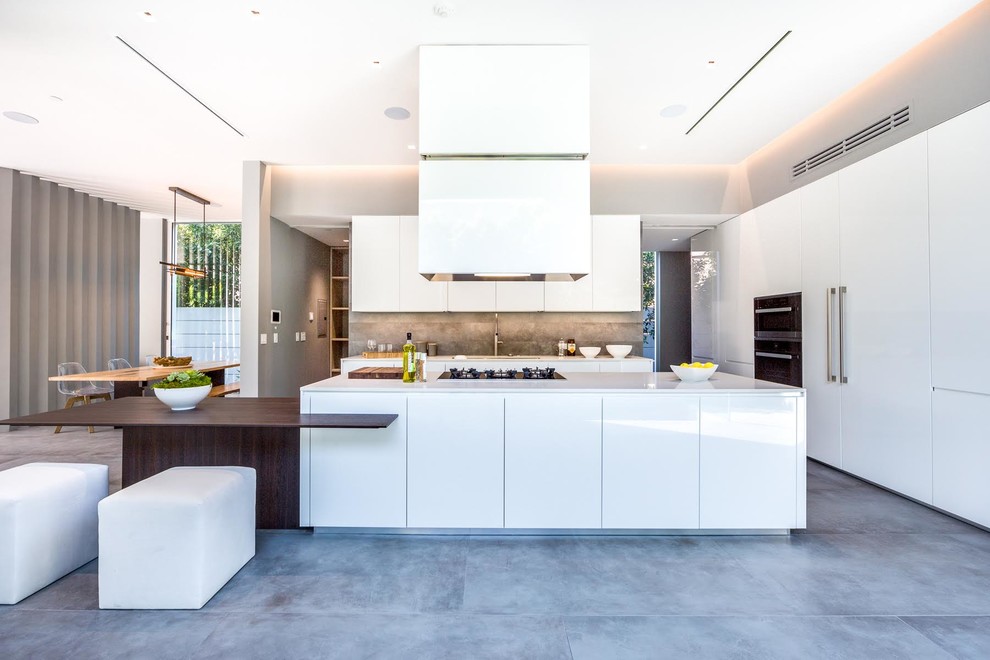 Design ideas for a contemporary eat-in kitchen in Paris with quartzite benchtops, grey splashback, stone tile splashback, black appliances, ceramic floors, with island, grey floor, flat-panel cabinets and white cabinets.