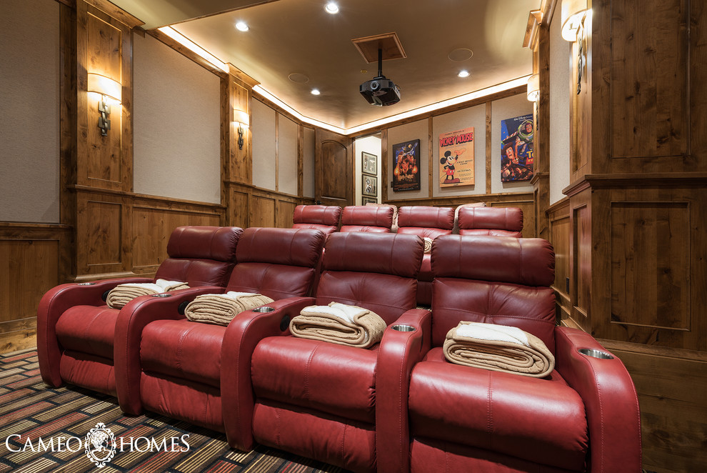 This is an example of a large country enclosed home theatre in Salt Lake City with carpet, white walls and a projector screen.