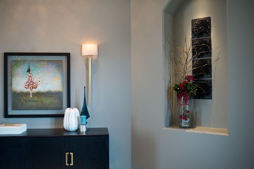 Example of a mid-sized transitional porcelain tile foyer design in Edmonton with gray walls and a black front door