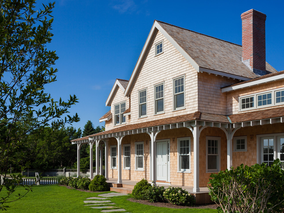 This is an example of a traditional two-storey exterior in Boston with wood siding.