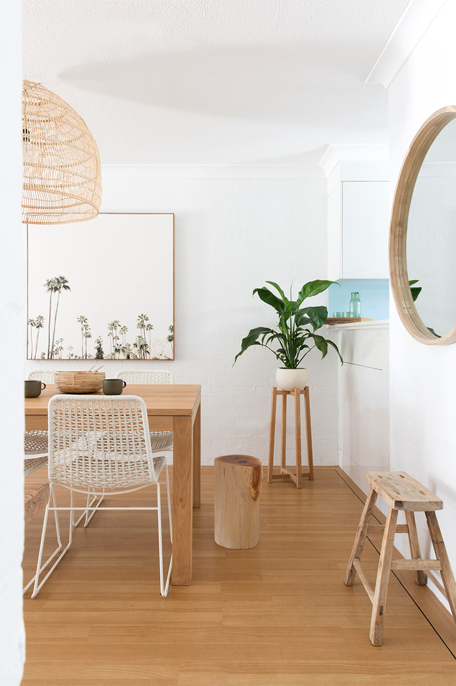 Photo of a beach style dining room in Brisbane.
