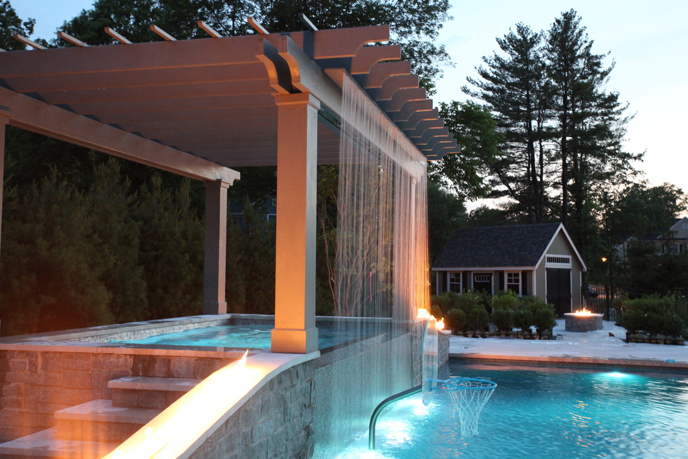 Large transitional backyard rectangular lap pool in New York with a hot tub and tile.