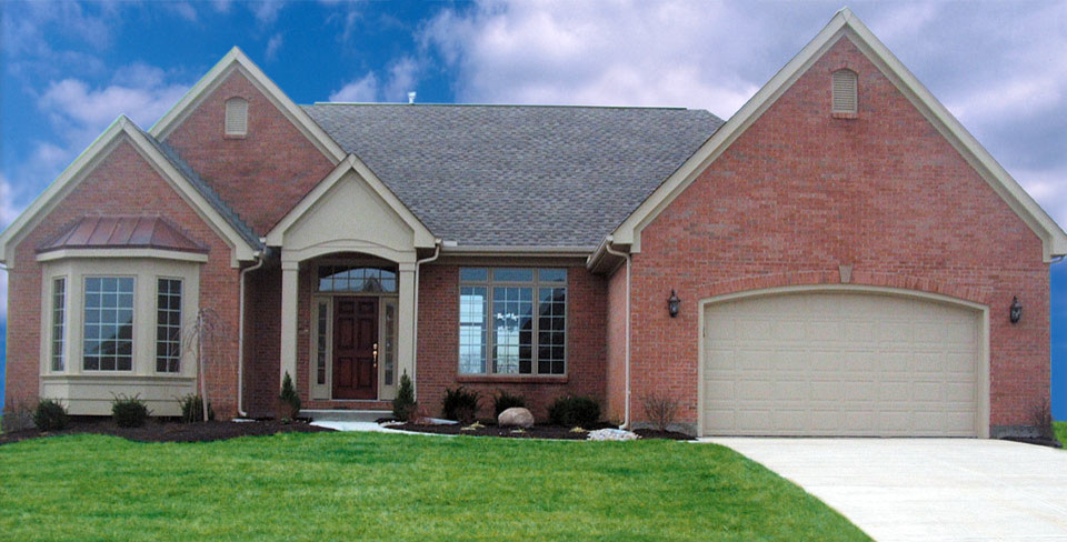 Example of a large transitional one-story brick exterior home design in Cincinnati