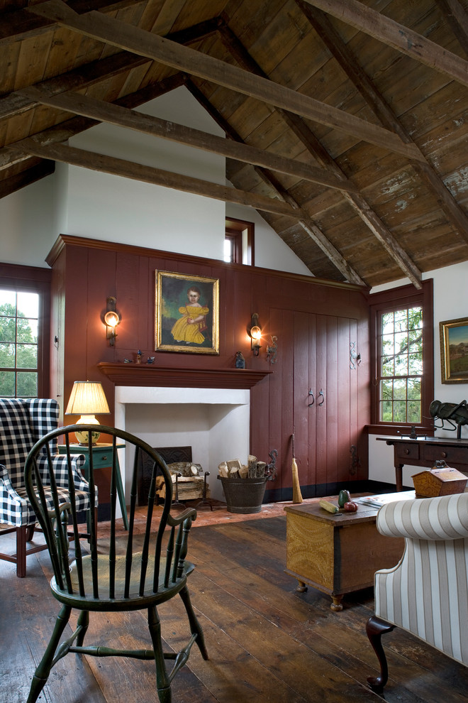 Design ideas for a country living room in Philadelphia with red walls, dark hardwood floors and a standard fireplace.