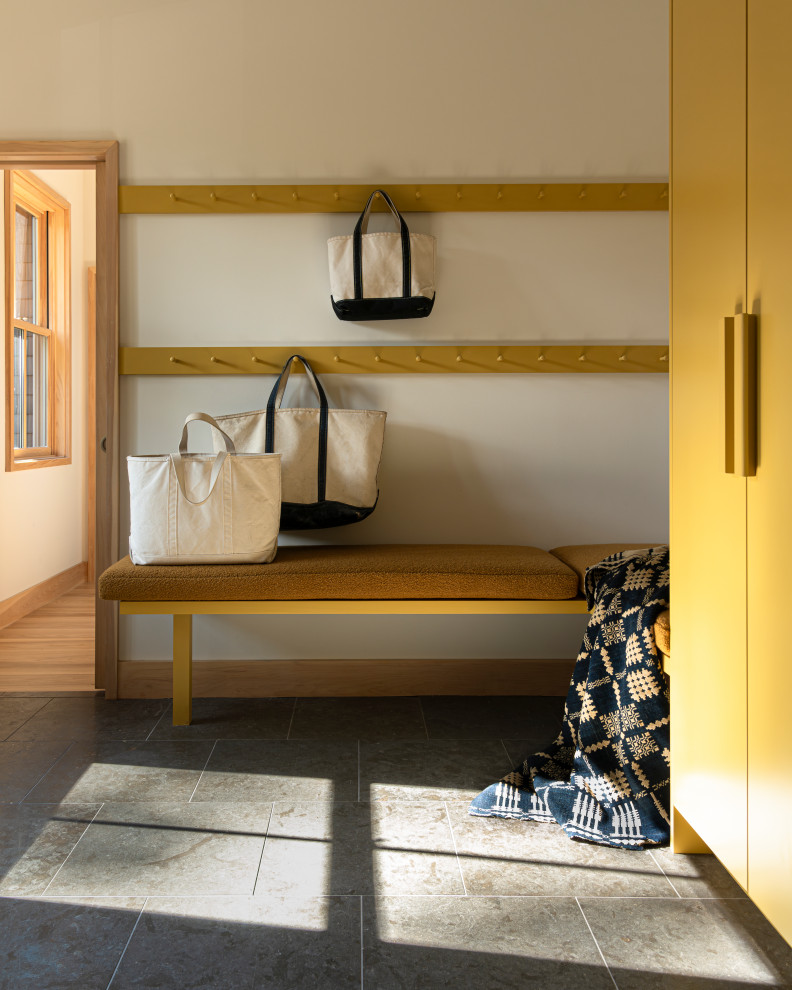 Mid-sized transitional mudroom photo in Portland Maine with white walls