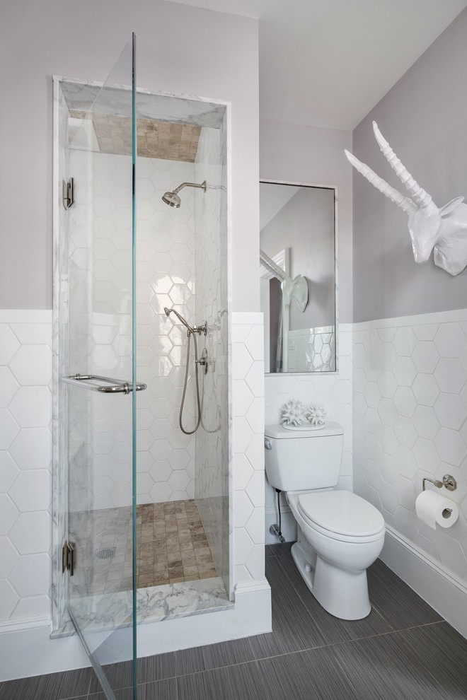 Photo of a mid-sized contemporary 3/4 bathroom in Boston with an undermount sink, flat-panel cabinets, medium wood cabinets, solid surface benchtops, an alcove shower, a two-piece toilet, white tile, ceramic tile, purple walls and ceramic floors.