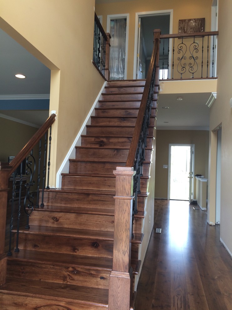 Inspiration for a mid-sized transitional wood straight staircase in Philadelphia with wood risers.