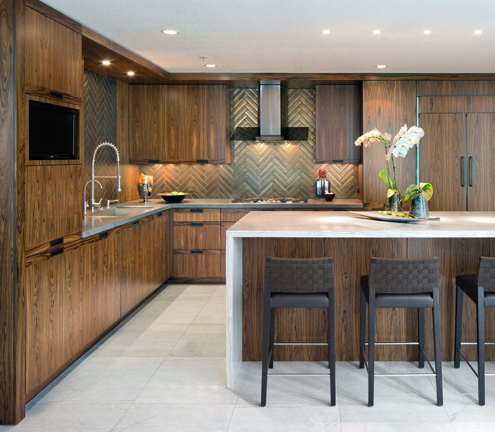Inspiration for a mid-sized contemporary l-shaped kitchen in San Diego with an undermount sink, flat-panel cabinets, dark wood cabinets, marble benchtops, brown splashback, terra-cotta splashback, panelled appliances, marble floors and with island.