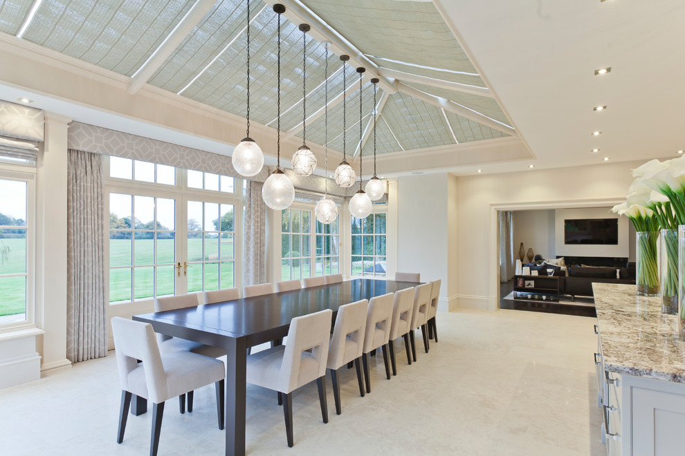 Photo of an expansive transitional dining room in West Midlands with ceramic floors.