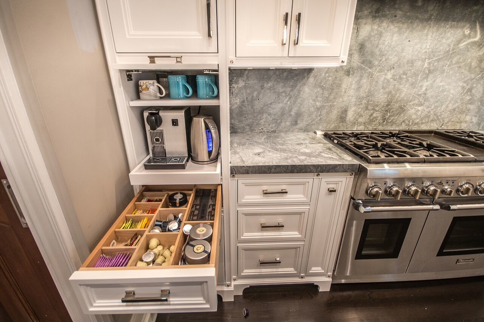 Eat-in kitchen - mid-sized transitional u-shaped dark wood floor eat-in kitchen idea in Chicago with a farmhouse sink, recessed-panel cabinets, white cabinets, quartzite countertops, stone slab backsplash, stainless steel appliances and gray backsplash