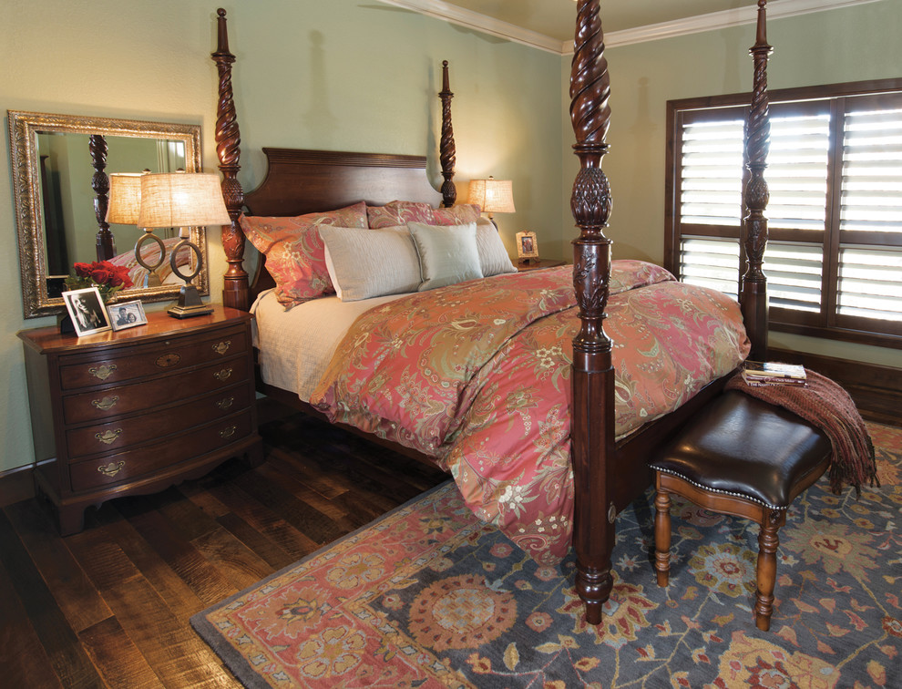 Photo of a mid-sized country master bedroom in Other with green walls and medium hardwood floors.