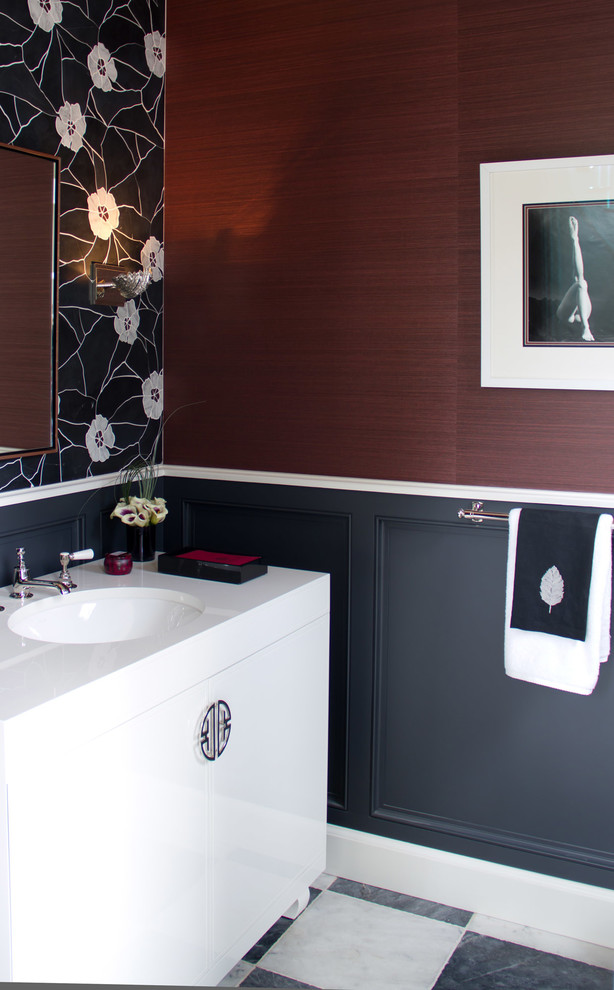 Photo of a transitional powder room in Los Angeles with flat-panel cabinets, white cabinets and white benchtops.