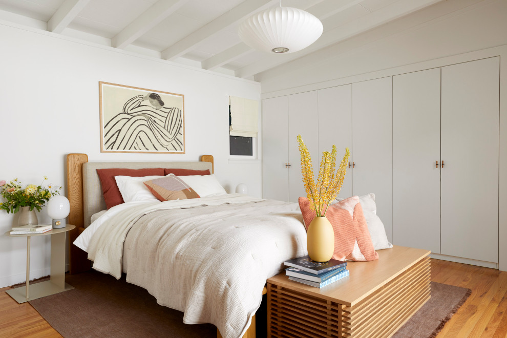 Photo of a medium sized midcentury master bedroom in San Francisco with white walls, medium hardwood flooring, brown floors and exposed beams.