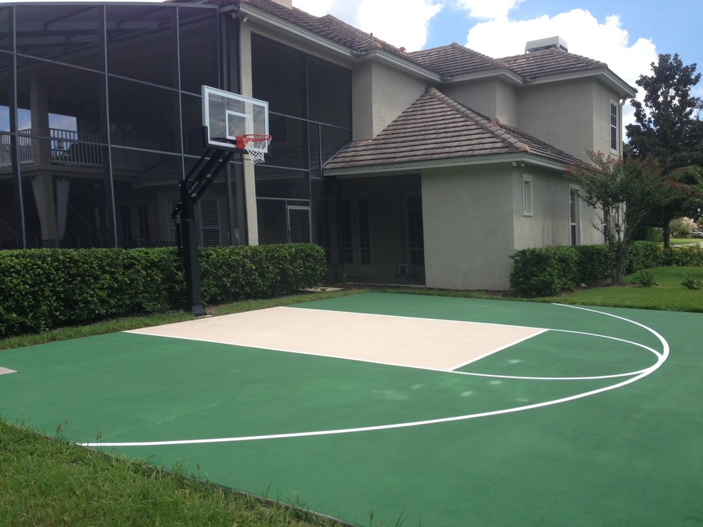 Design ideas for an expansive traditional backyard partial sun outdoor sport court in Orlando.