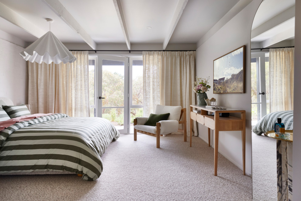 This is an example of a midcentury bedroom in Melbourne.