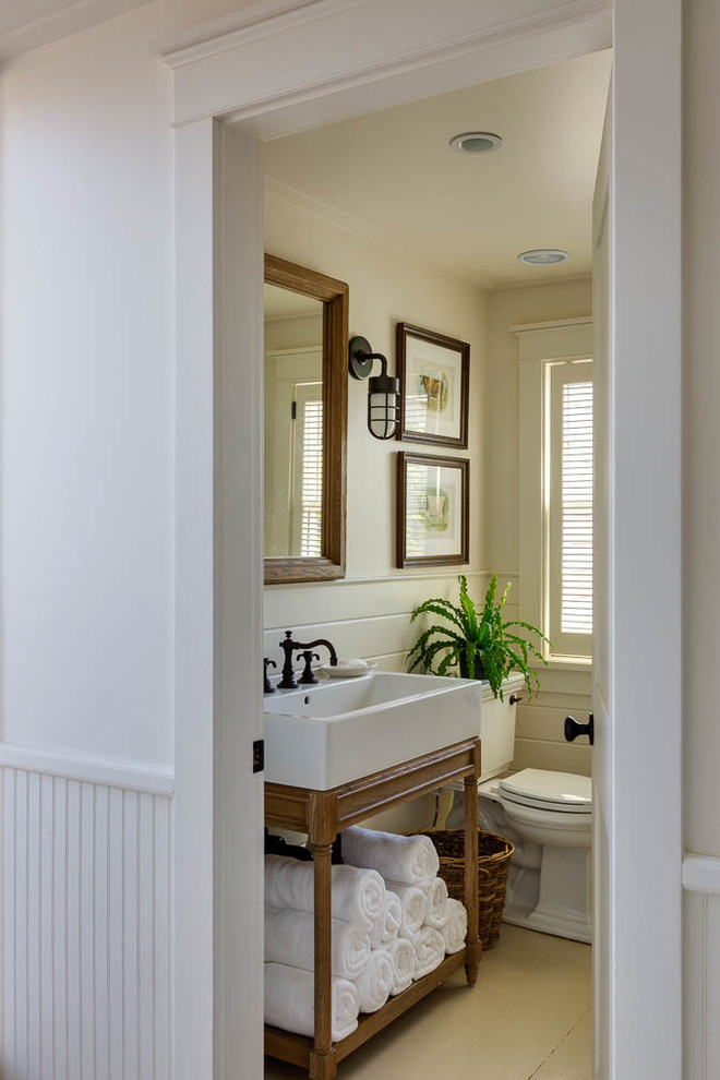 Bathroom - mid-sized coastal 3/4 light wood floor bathroom idea in Boston with medium tone wood cabinets, a one-piece toilet, white walls and a trough sink