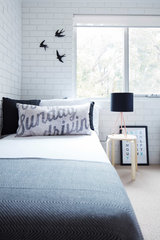 Inspiration for a scandinavian guest bedroom in Central Coast with white walls and carpet.
