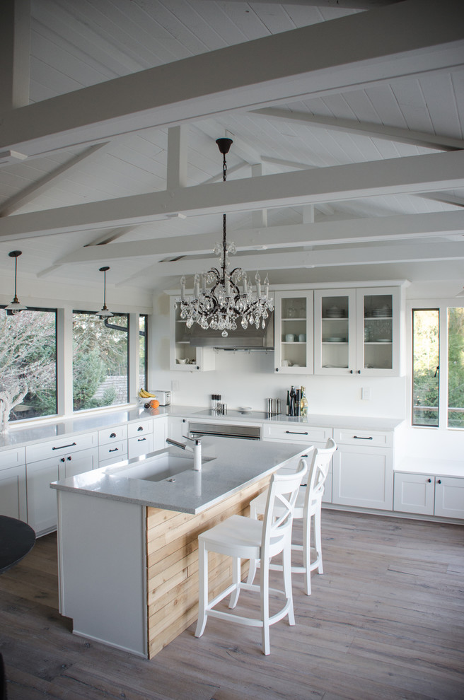 Transitional l-shaped kitchen in Seattle with an undermount sink, recessed-panel cabinets and white cabinets.
