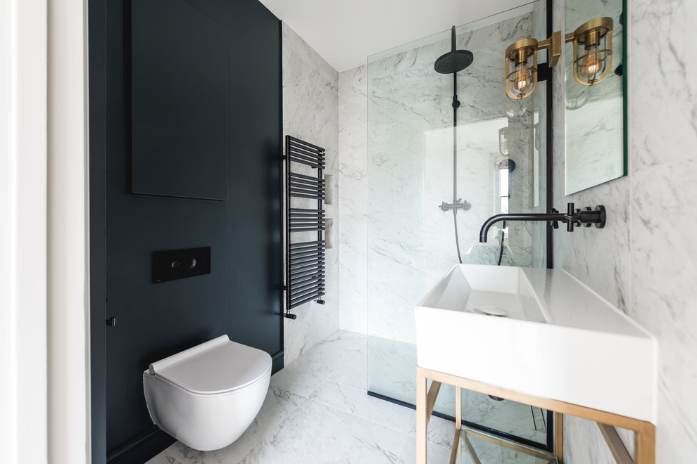 This is an example of a small contemporary 3/4 bathroom in London with flat-panel cabinets, blue cabinets, an open shower, a one-piece toilet, black and white tile, marble, grey walls, marble floors, a console sink, grey floor and an open shower.