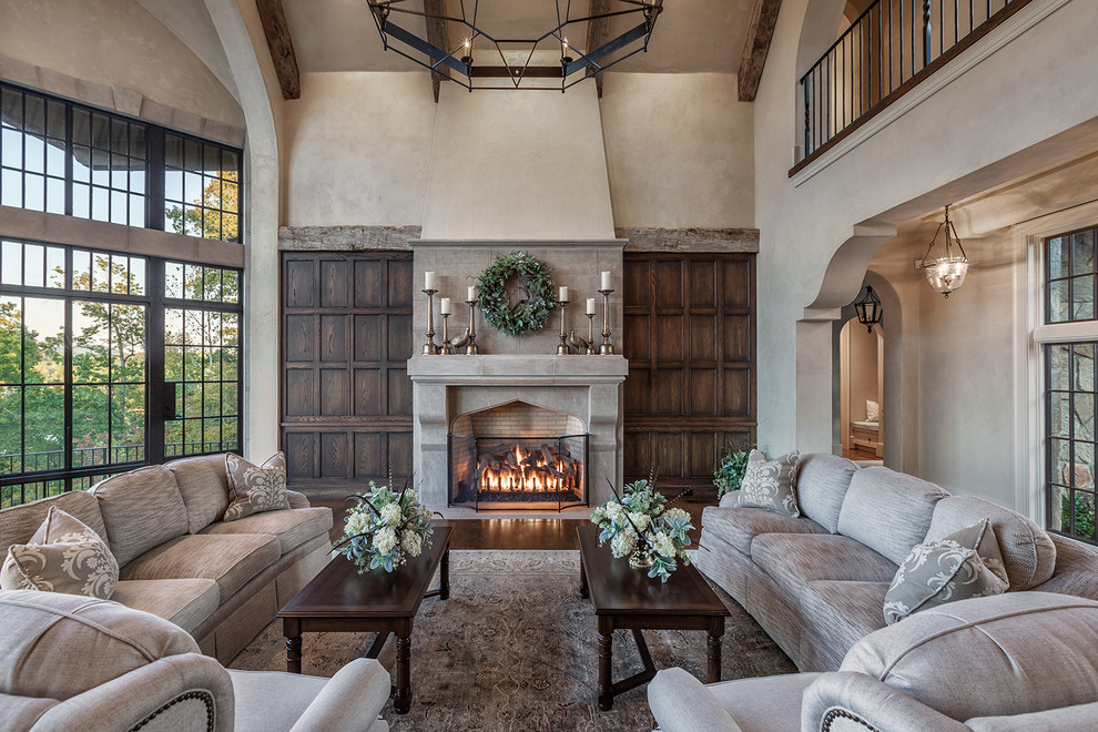 Large country formal open concept living room in Other with medium hardwood floors, a standard fireplace, a stone fireplace surround, beige walls and no tv.