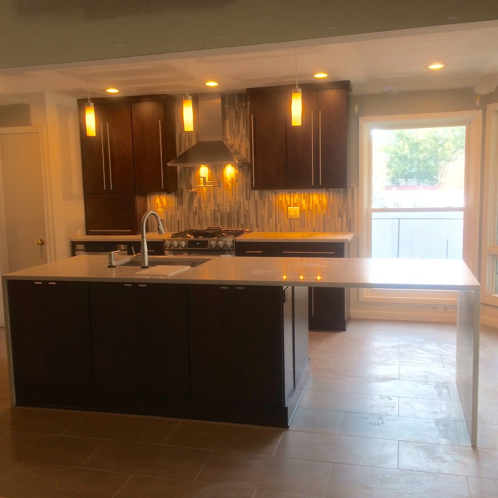 Inspiration for a modern l-shaped ceramic tile eat-in kitchen remodel with an undermount sink, flat-panel cabinets, dark wood cabinets, marble countertops, multicolored backsplash, matchstick tile backsplash, stainless steel appliances and an island