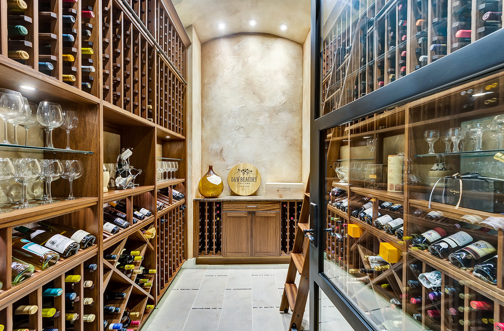 Design ideas for a mid-sized mediterranean wine cellar in Dallas with storage racks.