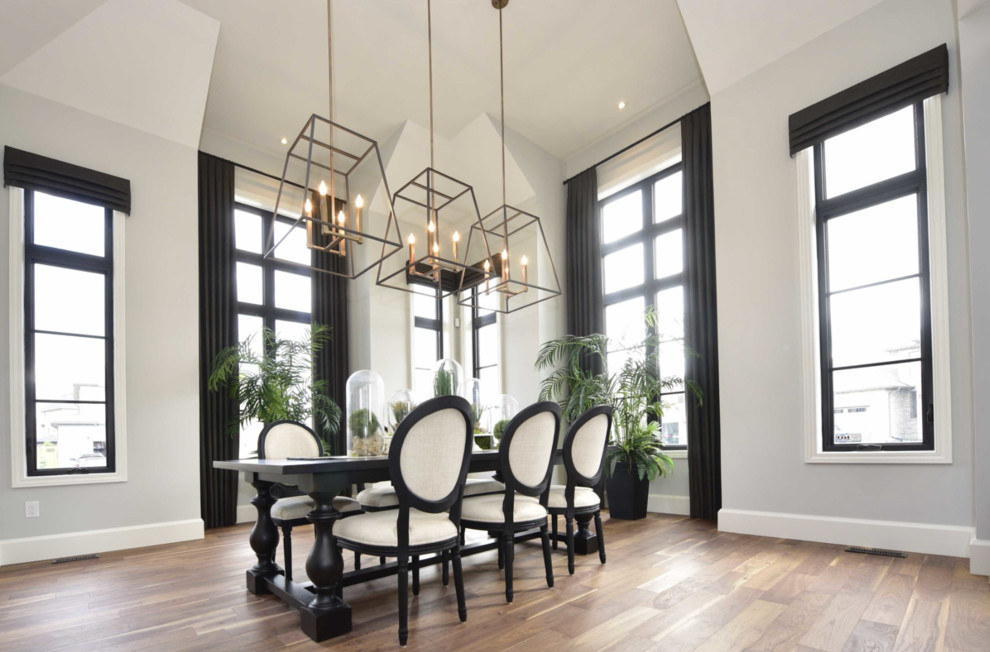 Example of a large transitional medium tone wood floor and brown floor kitchen/dining room combo design with gray walls and no fireplace