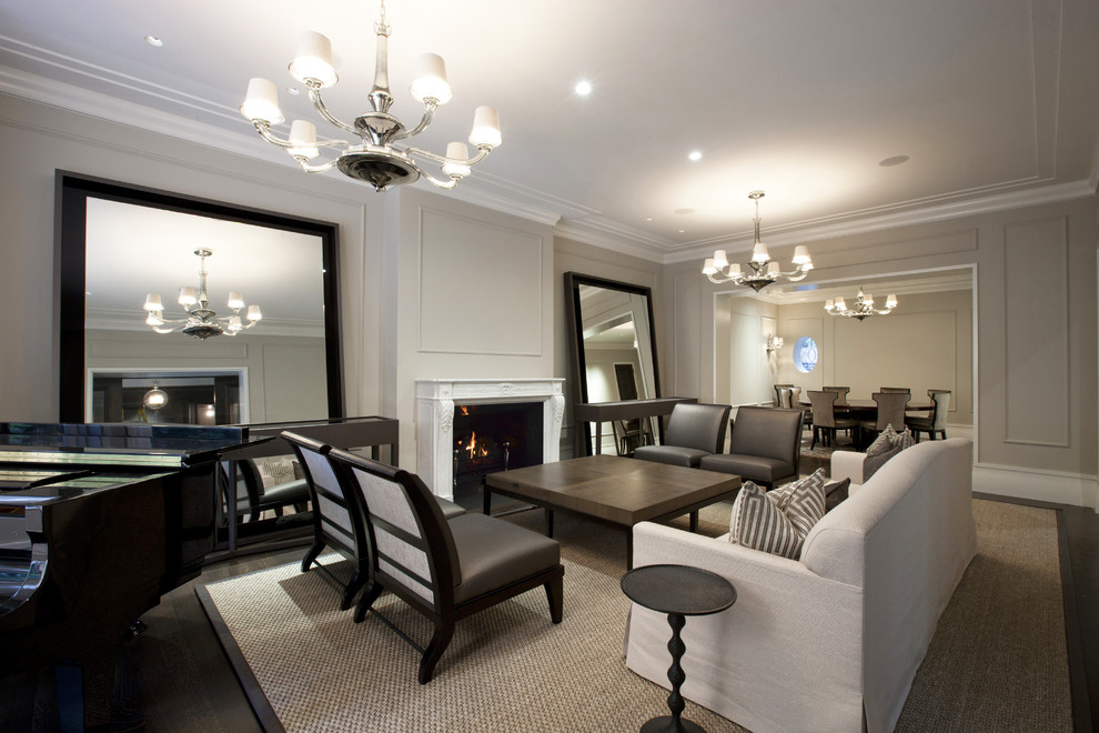 This is an example of a contemporary formal living room in Chicago with grey walls and a standard fireplace.