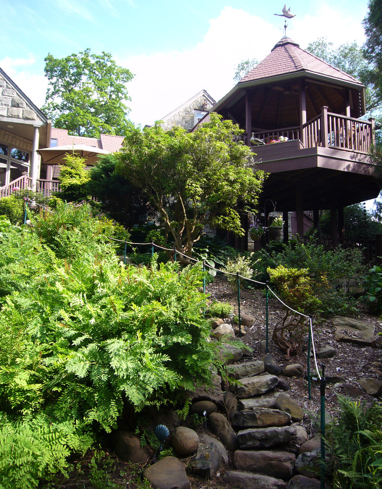 Inspiration for a large rustic backyard deck remodel