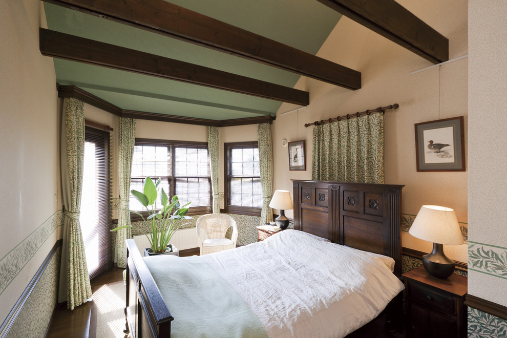 Farmhouse bedroom in Other with beige walls.