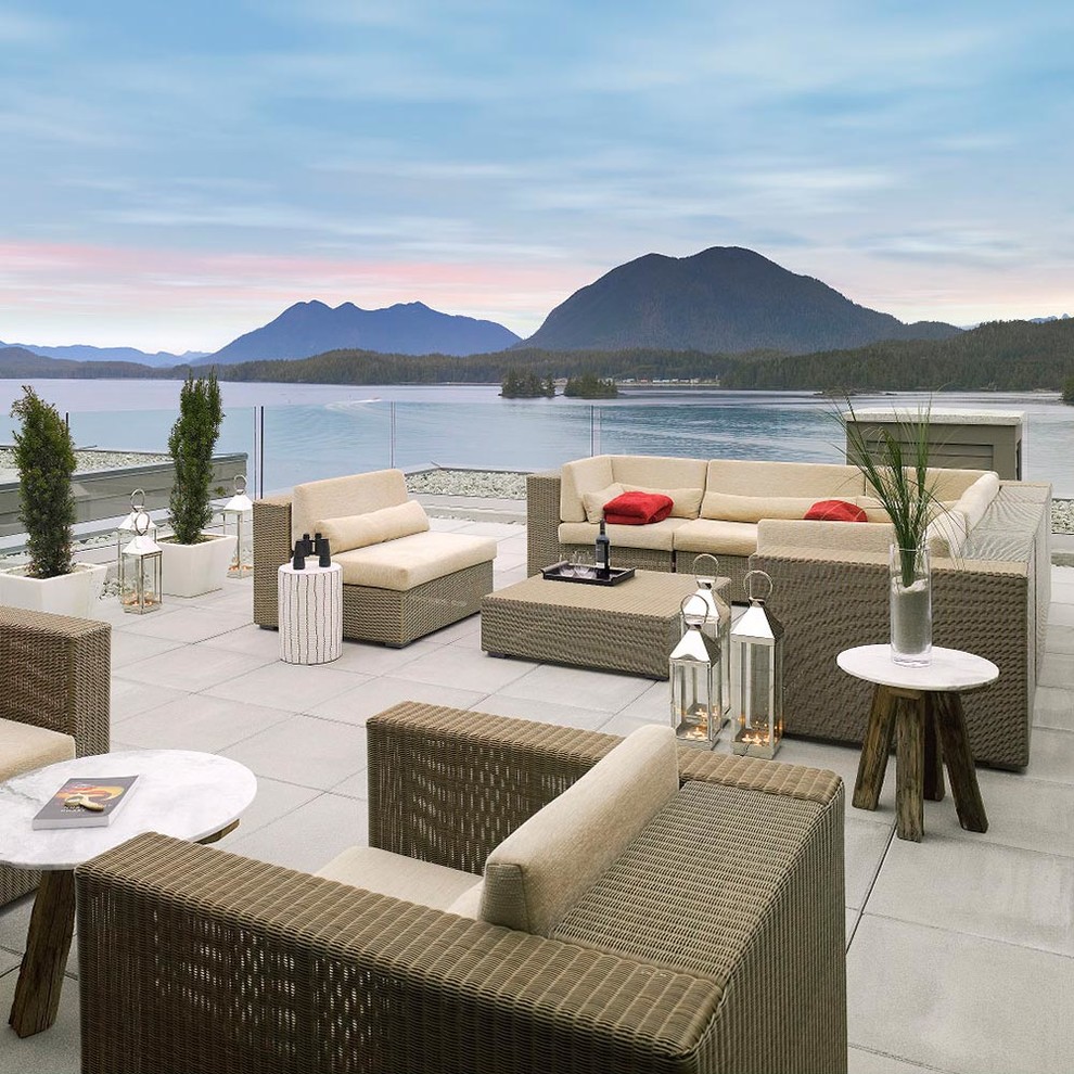 Example of a beach style rooftop rooftop deck design in Calgary with no cover