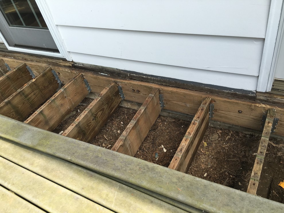 REPLACING JOIST SUPPORTS ON DECK.