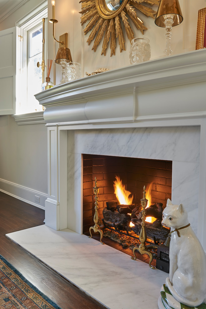 Inspiration for a transitional family room in New York with a standard fireplace and a stone fireplace surround.