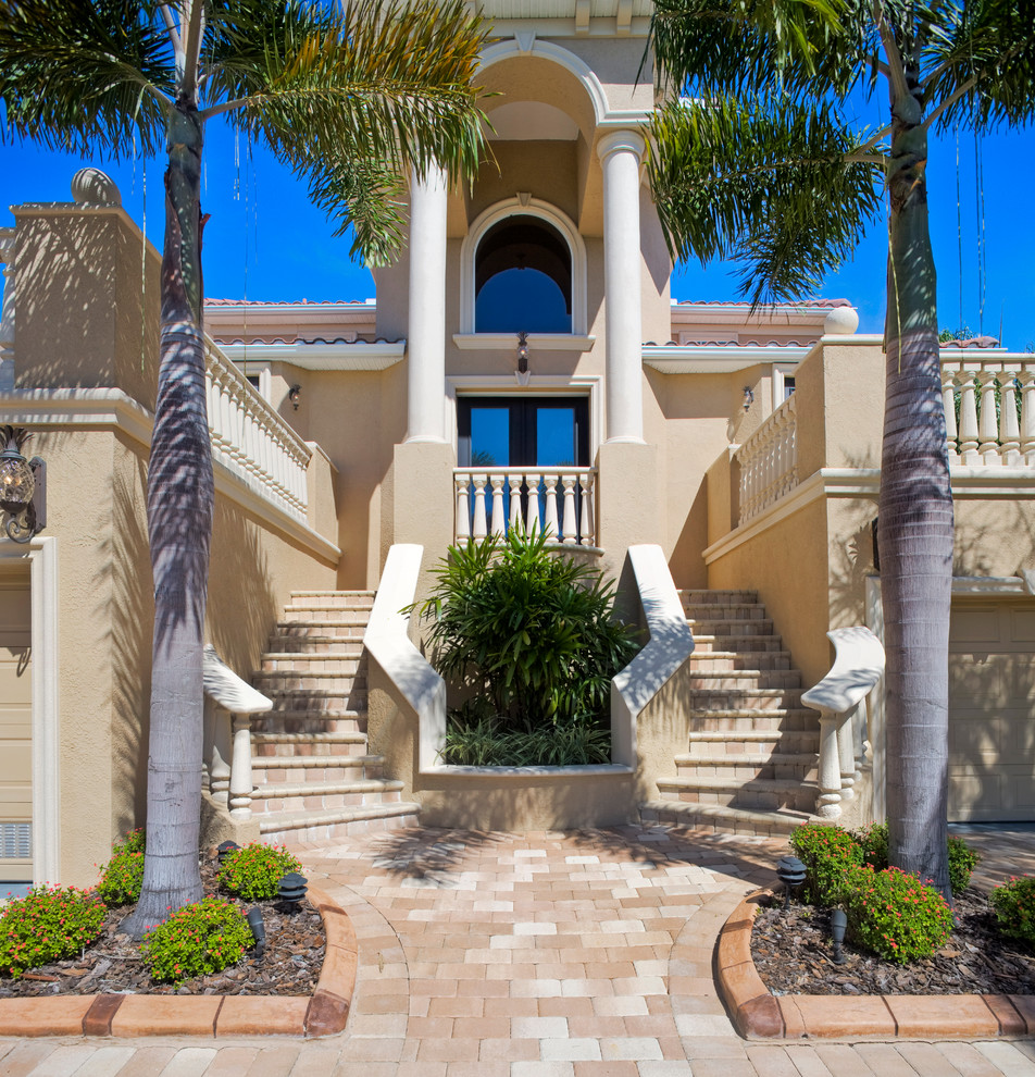 Inspiration for a mediterranean two-storey exterior in Tampa.