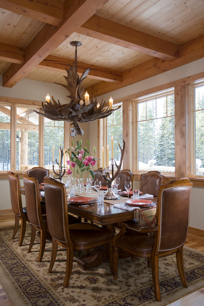 Large country dining room in Other with beige walls, light hardwood floors and brown floor.