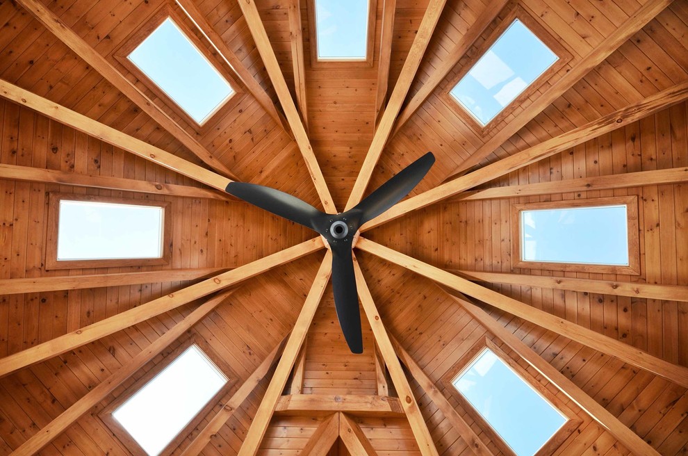 Inspiration for a huge rustic light wood floor and beige floor home design remodel in Toronto with a skylight