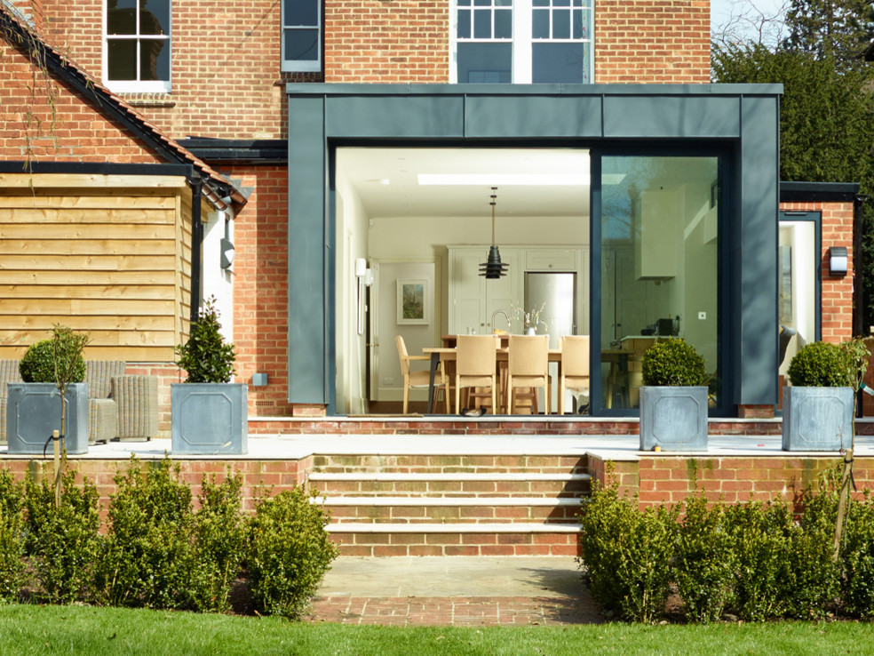 Mid-sized contemporary exterior in Oxfordshire with metal siding.