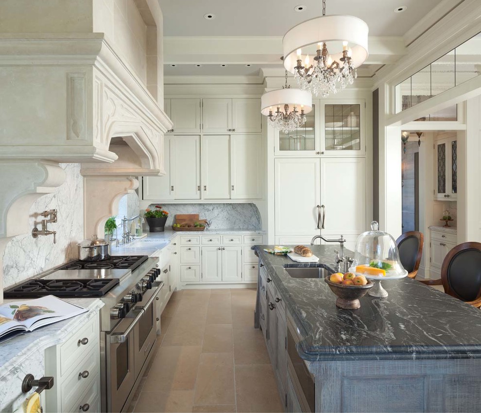 Photo of a large traditional kitchen in Minneapolis with marble benchtops, white splashback, stone slab splashback, panelled appliances, travertine floors and with island.