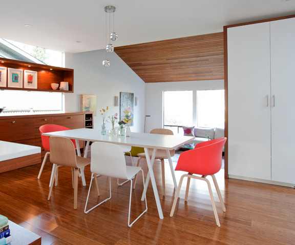 Inspiration for a large contemporary kitchen/dining combo in Vancouver with white walls and bamboo floors.