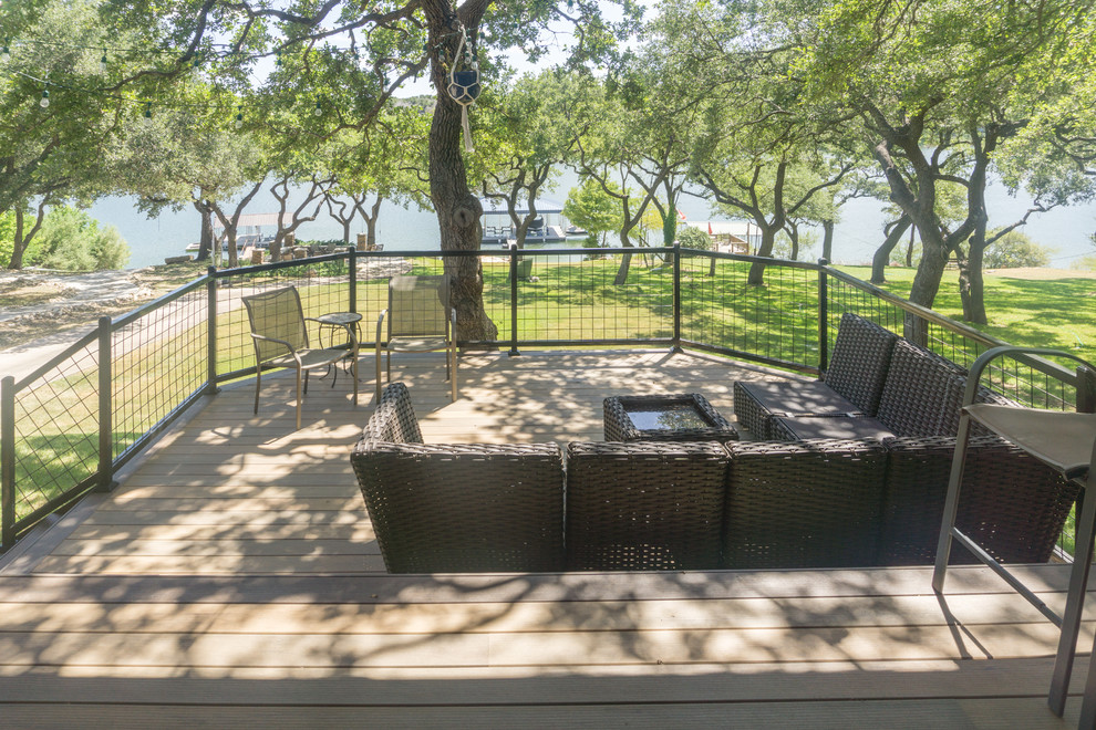 Deck - large rustic backyard balcony deck idea in Austin