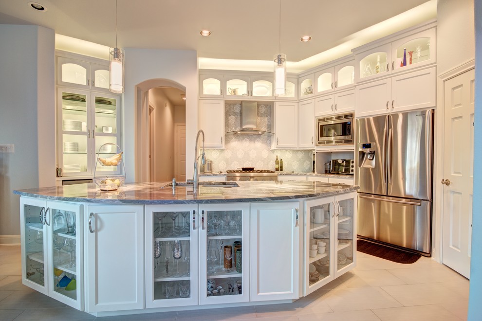 Inspiration for a mid-sized transitional porcelain tile eat-in kitchen remodel in Austin with an undermount sink, recessed-panel cabinets, white cabinets, marble countertops, gray backsplash, mosaic tile backsplash and stainless steel appliances