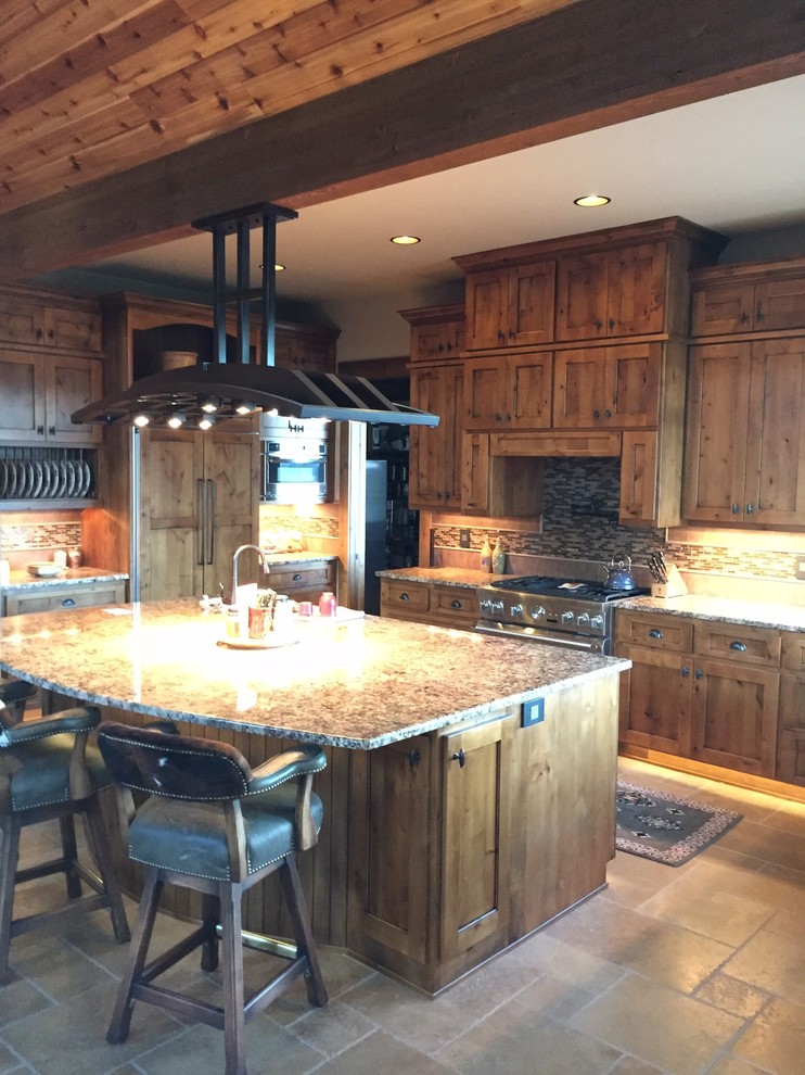 Kitchen - mid-sized rustic porcelain tile and beige floor kitchen idea with an undermount sink, recessed-panel cabinets, light wood cabinets, granite countertops, beige backsplash, matchstick tile backsplash, paneled appliances and an island