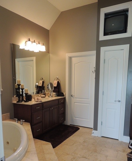 Photo of a large traditional master bathroom in Indianapolis with beige tile and ceramic tile.