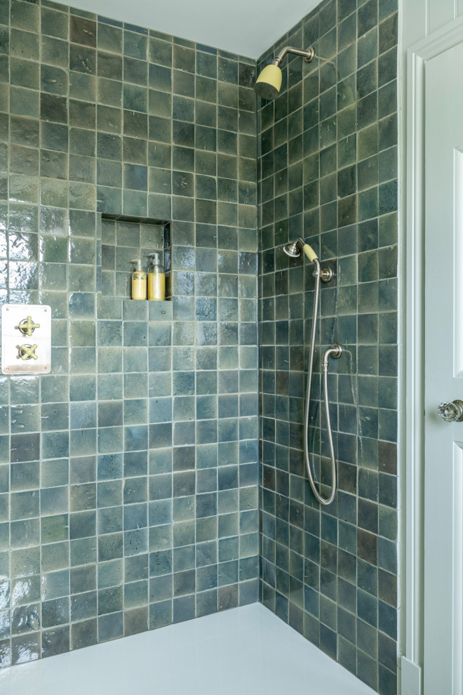 This is an example of a small transitional master bathroom in Buckinghamshire with green tile, cement tile and green walls.