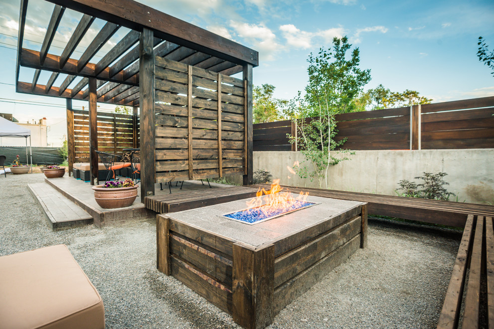 Design ideas for a country patio in Denver with a fire feature, gravel and a pergola.