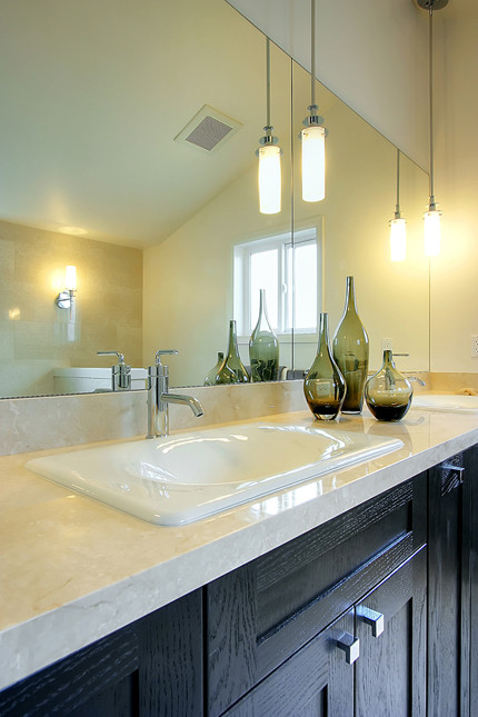Inspiration for a transitional bathroom in Seattle with a vessel sink, flat-panel cabinets and dark wood cabinets.