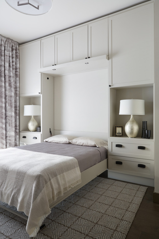 Inspiration for a transitional guest bedroom in Nashville with dark hardwood floors, brown floor and white walls.