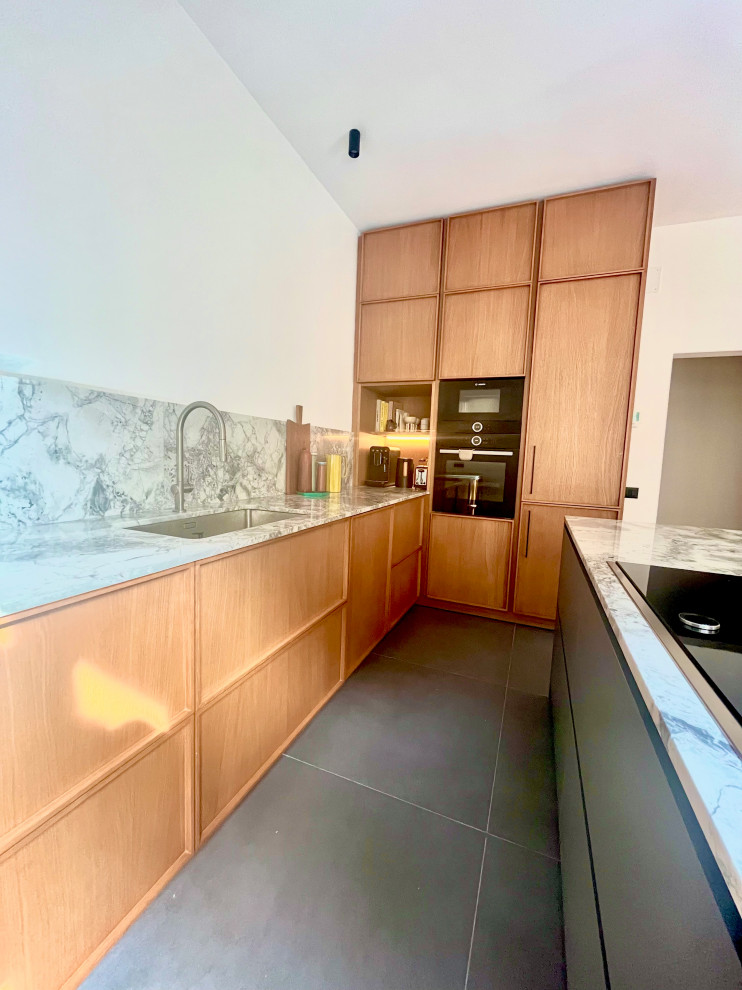 Inspiration for a contemporary open plan kitchen in Barcelona with an undermount sink, medium wood cabinets and with island.