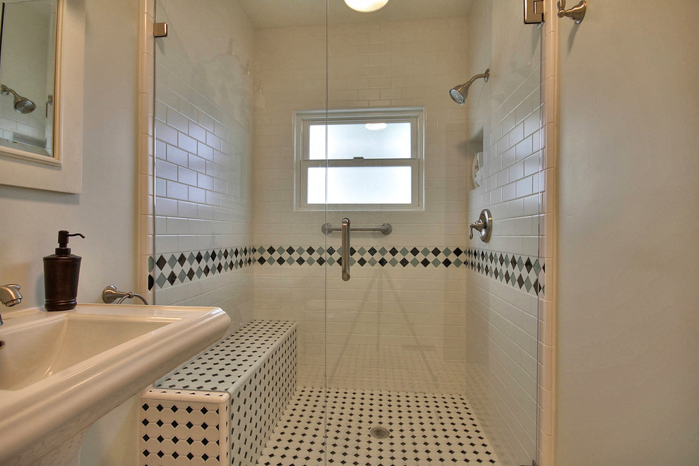 Mid-sized transitional 3/4 bathroom in San Francisco with a pedestal sink, a curbless shower, white tile, subway tile and green walls.